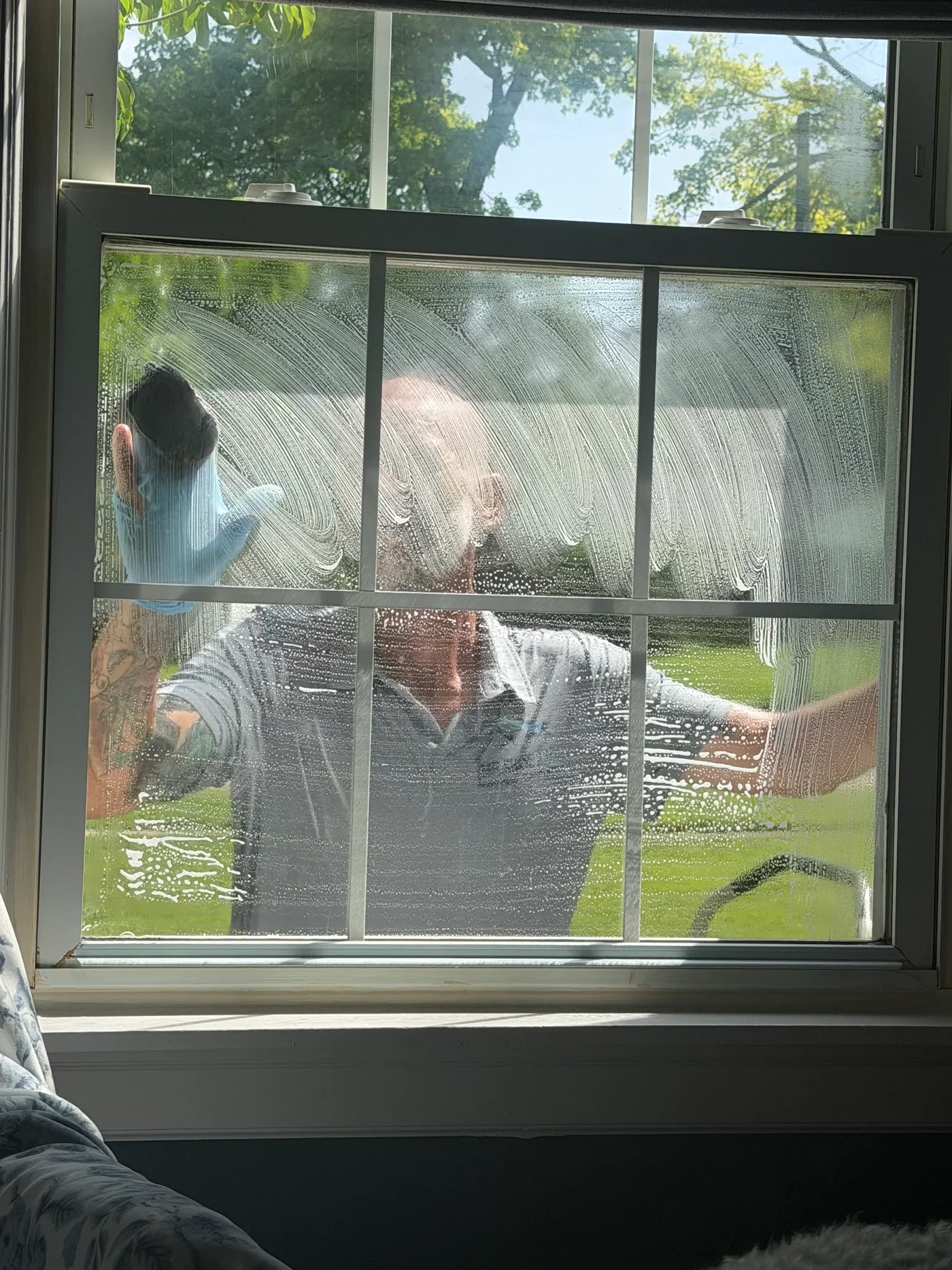 Shawn from Mr ShinePro cleaning a residential window in Middletown, Ohio