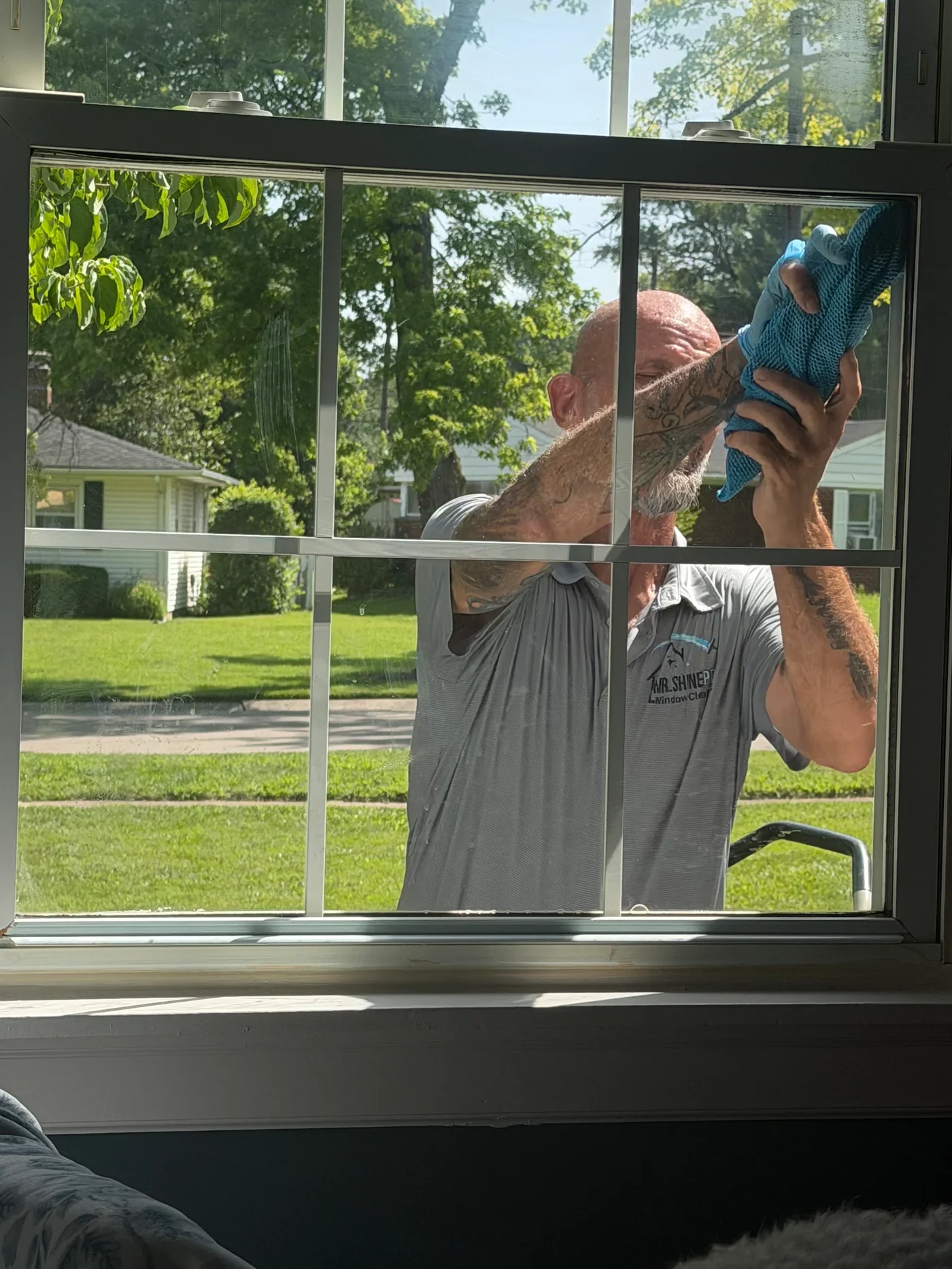 Shawn from Mr ShinePro detailing and finishing a window at a Middletown, Ohio home